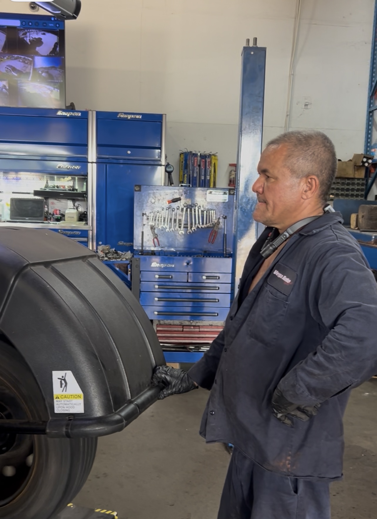 Technician inspecting a wheel